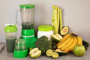 Blender, ingredients for healthy homemade smoothie on kitchen table photo