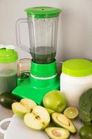 Blender, ingredients for healthy homemade smoothie on kitchen table photo