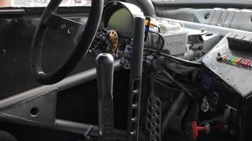 Cabin interior of a modified drift car. Luxury racing sports car. Drift car interior. Focus on the strut, close-up on the wheel and gearshift clutch. Ukraine, Kyiv - August 22, 2021. video