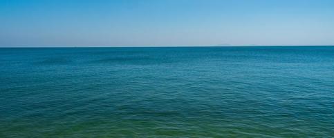 front view landscape Blue sea and sky blue background morning day look calm summer Nature tropical sea Beautiful  ocen water travel Bangsaen Beach East thailand Chonburi Exotic horizon. photo