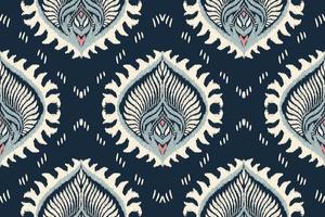 Damask Ikat floral paisley embroidery on navy blue background.Ikat Ethnic oriental pattern traditional.Aztec style abstract vector illustration.design for texture,fabric,clothing,wrapping,scarf,carpet