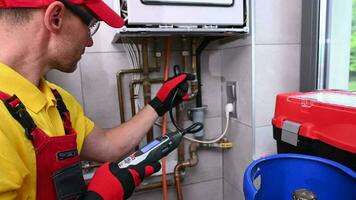 HVAC Technician with Gas Leak Detector in His Hands Checking on Levels video