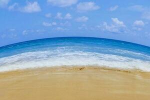 Light blue sea waves on clean sandy beach, Tropical white sand beach and soft sunshine background photo