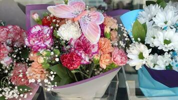 a bouquet of flowers is displayed in a store window video