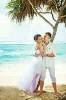 Newly married couple on the beach photo