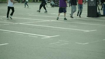 Teenagers playing basketball in a city park video