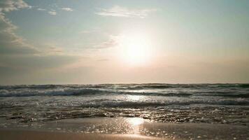 Sea horizon during a beautiful sunset. Sea beach and sunset light. Summer vacation concept. Summertime. Slow motion. video