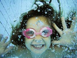 Underwater portrait of a happy girl photo