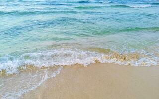 Waves at tropical beach caribbean sea clear turquoise water Mexico. photo