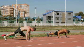 Two athlets prepare for training video