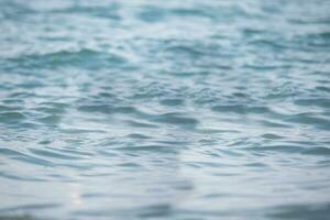 Blue light sea water texture with slight wave. photo