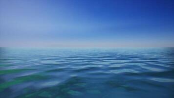 A large body of water with a blue sky in the background video