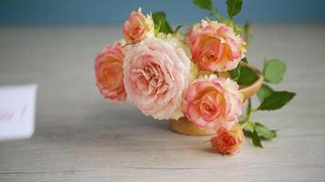 bouquet of beautiful roses on a wooden table video