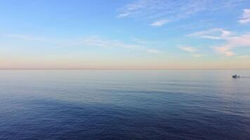 Aerial view of the sea with a ship going into the sea. video