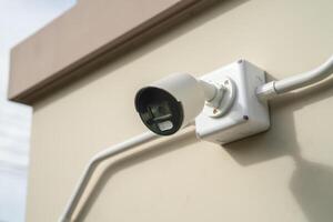 CCTV Closed circuit camera at wall house, security system concept. photo