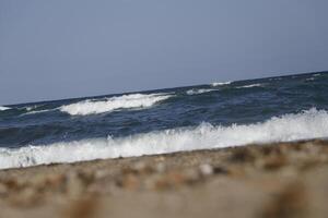 rough sea with many waves, no straight horizon, it feels like you are swaying on the waves photo