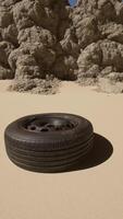 A tire sitting in the middle of a desert video