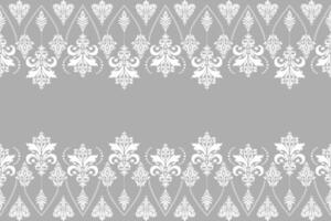 White damask seamless pattern of floral and leaf motifs on grey background vector