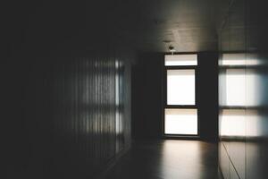 A beautiful window with soft light. Abandoned hallway with light at the end shining photo