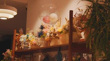 Charming Flower Arrangements on a Wooden Shelf video