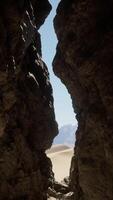 A narrow passage between two large rocks video