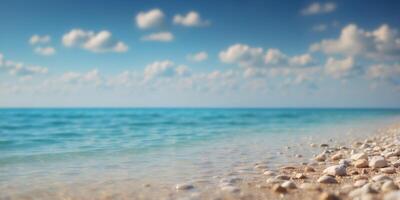 A expansive body of water rests upon a sandy shore under a blue sky, dotted with a few white clouds. photo