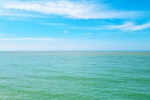 Tranquil Ocean Horizon with Clear Blue Sky and Gentle Waves - Ideal for Nature, Travel, and Inspirational Posters photo