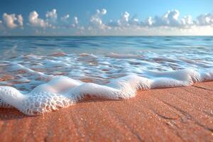 Peaceful Ocean Waves Rolling onto Sandy Beach Under Clear Blue Sky - Coastal Serenity for Relaxation and Nature Themes photo