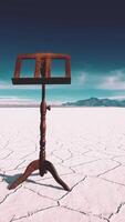 an old music stand is on white salt desert video