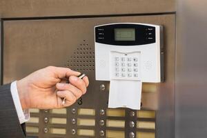 Businessperson Hand Operating Security System photo