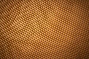 A textured brown pique fabric background with a subtle, ribbed pattern photo