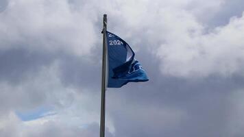 Playa del Carmen Quintana Roo Mexico 2023 Blue flag with cloudy windy sky at certificated beach in Mexico. video