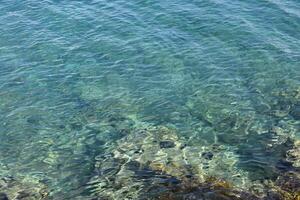 Beautiful, calm blue green water of the Adriatic Sea, Lumbarda, Croatia. photo