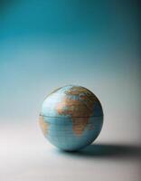 Small globe isolated on clean background photo