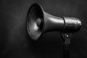 Black megaphone on a black background photo