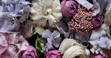 Rotating spring summer floral pastel arrangement in the background close up. Celebrating Mother's Day, International Women's Day March 8. Flowers gardenia, rose, peony video