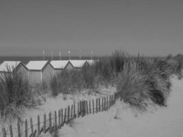 Beach huts on the beach in black and white photo