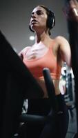 A fit girl dressed in a sports outfit, running on a treadmill, at the gym. Flexibility, sports and loosen muscles. Athletic girl, Healthy workout, training for weight loss. video