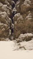 A group of rocks sitting in the middle of a desert video