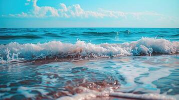 Sea waves on the beach with a blue sky photo