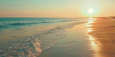 An empty beach with the sun dipping below the horizon, photo