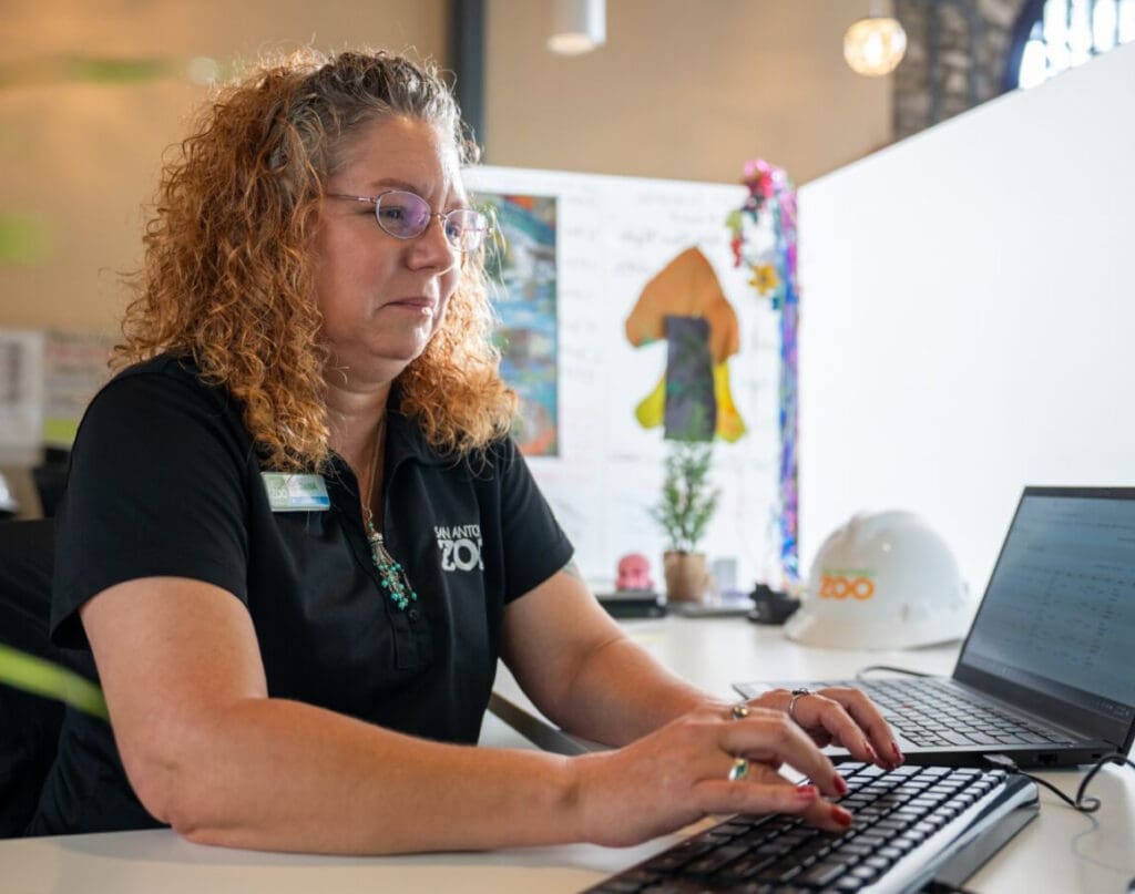 San Antonio zoo employee working at her desk.