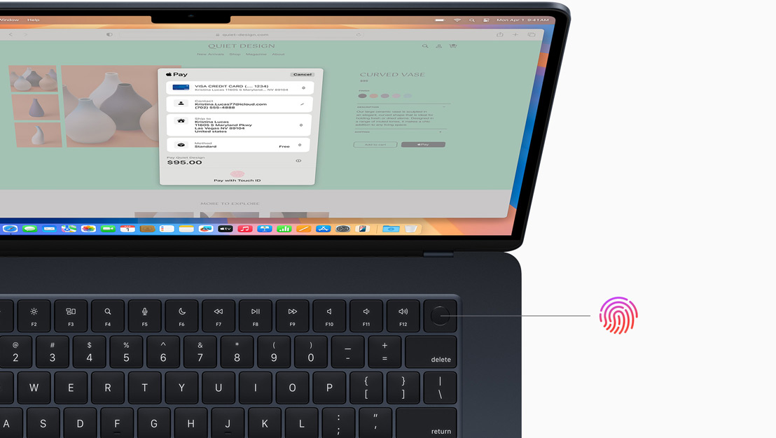 En åpen MacBook Pro i stellarsvart, som viser hvor Touch ID-knappen er plassert.