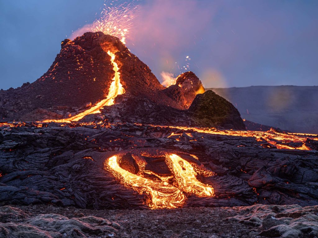 a volcano erupting with lava