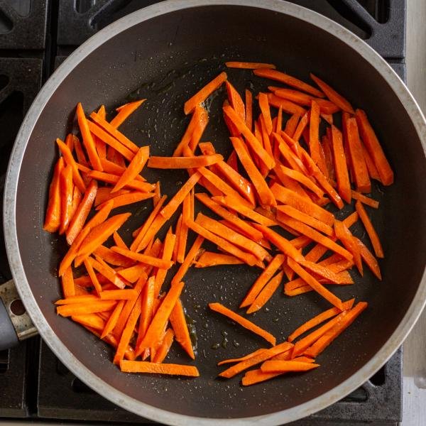 carrots getting browned in a skillet