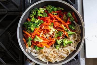 all the veggies frying in a skillet