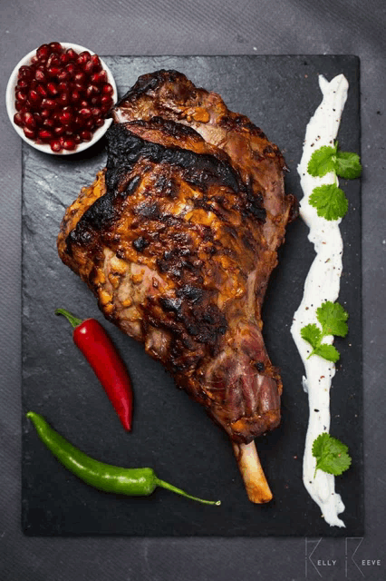 a large piece of meat on a cutting board with kelly keeve written in the corner