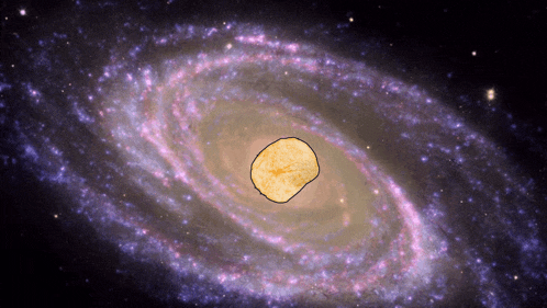 a picture of a galaxy with a potato chip in the center