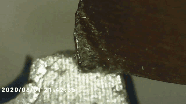 a close up of a piece of metal with the date of 2020/08/01