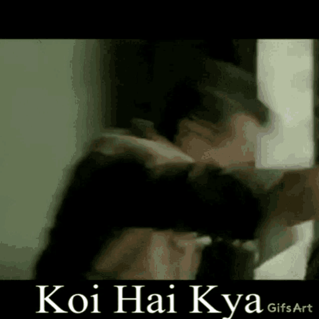 a man is standing in front of a door with the words koi hai kya written on the bottom